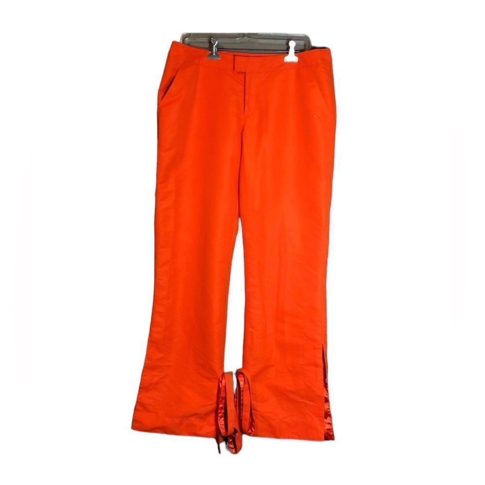 Puma bright orange pants.